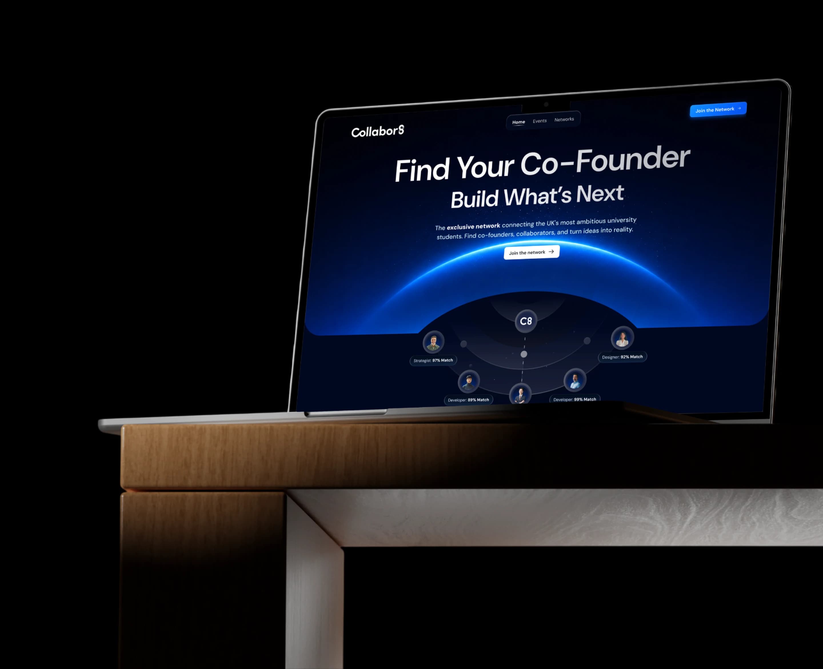 The Collabor8 landing page on a laptop standing on a wooden desk: the headline Find Your Co-Founder, Build What's Next, over a blue horizon with five student profiles and their match percentages.