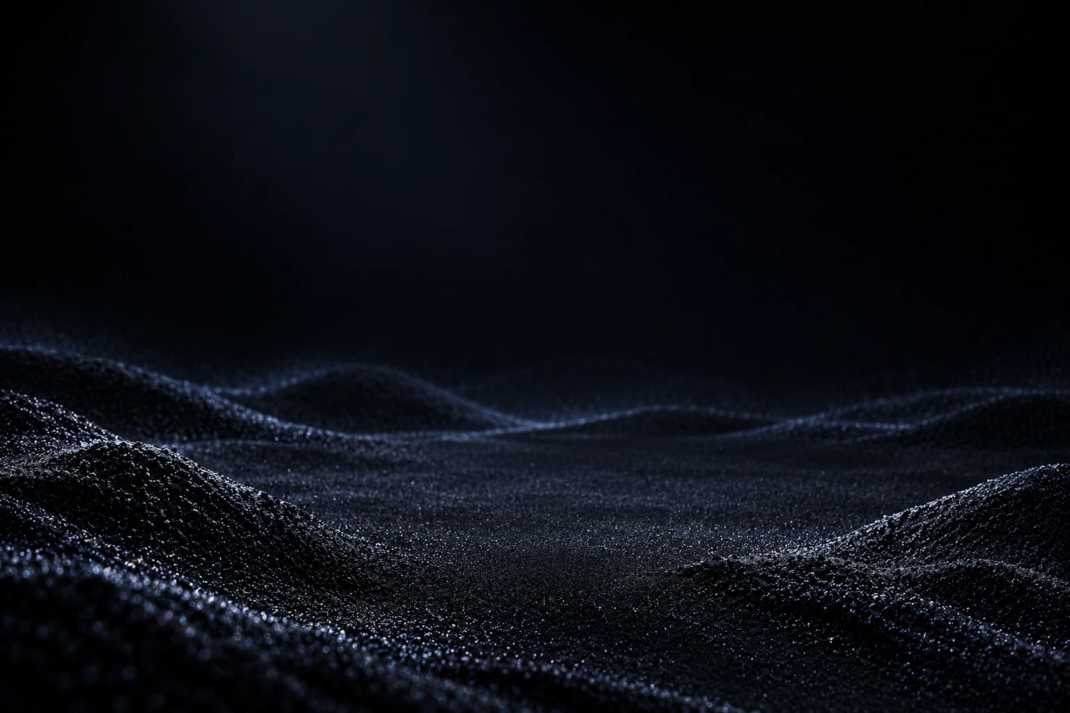 Dark sand ridges in quiet light.